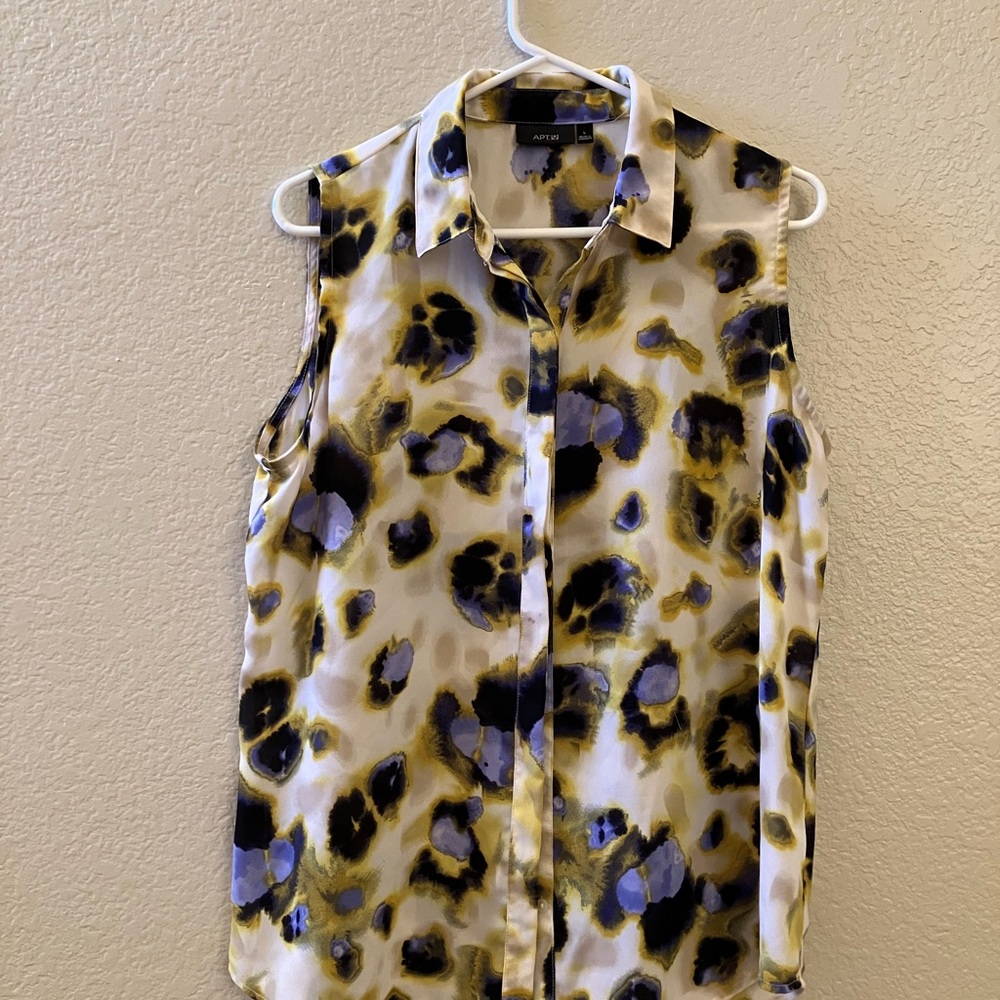 Summer top, button down, wear alone or use as an outer shirt! Slit in the back!